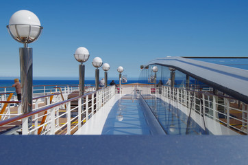 Sun deck with deck chairs, sun loungers or beds, whirlpool and bar on modern cruiseship or cruise...