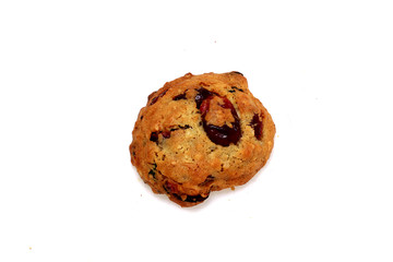 One cookie with berries on a white background
