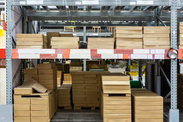 Rows of shelves with boxes in modern warehouse. Warehouse Goods Stock Concept.