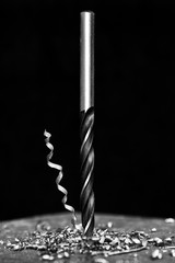 steel drill on black background
