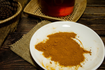 herb powder in the white dish