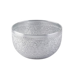 Silver color water bowl in Thai style used in religious ceremonies isolated on white
