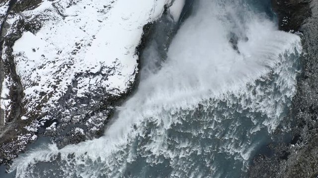 Drone top-down view of Dettifoss Waterfall, Iceland - wide rotating shot