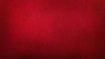 grunge dark red gradient stucco wall background. abstract grainy red wall background with space for...