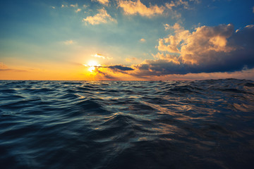 Sea wave close up, low angle view, sunrsie shot