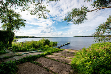Summer landscape overgrown bank of the russian volga river on a sunny day
