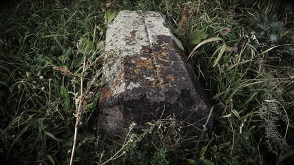 Obraz premium Ancient Armenian cemetery. Christian Grave of 1800. Burial place. Carved tombstone. Very old threaded stones. Memorial to the memory of the old world. Historical memory.