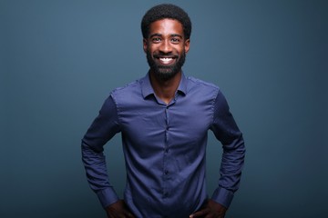 Fototapeta premium Beautiful afro man in front of a background