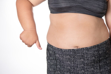 Fat women has overweight show hand unlike. she shows excess fat of the abdomen. isolated on white background.