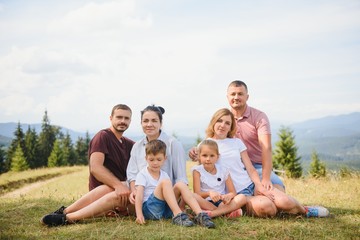 Young family with child resting on a mountain. vacation in the national park