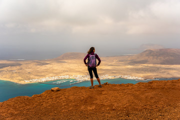 Tourist girl looking from Mirador del Rio, Lanzarote, Canary Islands