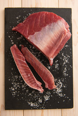 Large piece of fresh tuna with salt.
