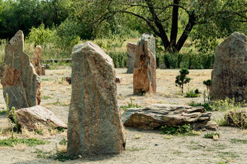 Tall stones standing close to each other.