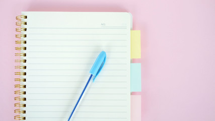 Open blank journal on pink background. Concept for creative person planning. Back to school. Top view, flat lay, mockup