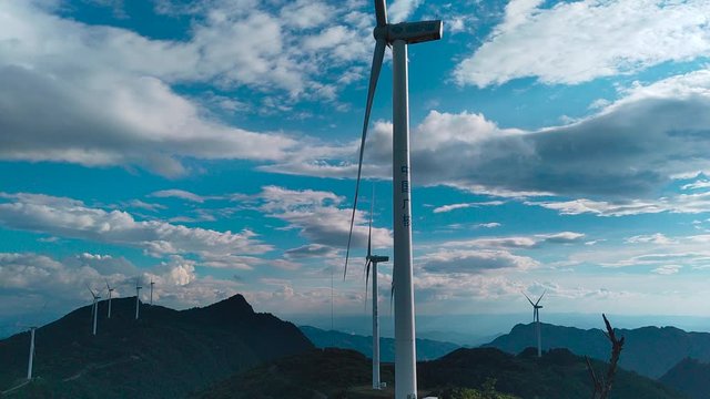 there are some wind-driven generators on the top of the mountain