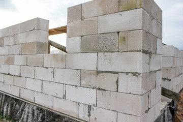 Street lighting. Start building a white block residential building. Laying takes place on an...