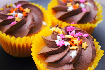 Sugar stars on chocolate fancy cup cakes