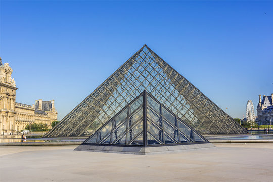 View of Louvre pyramid at courtyard of Louvre Museum. Louvre Museum is one of the largest and most visited museums worldwide. PARIS, FRANCE. July 16, 2017.