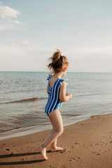 Fototapeta na wymiar baby girl on the beach