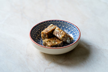 Raw Bites Flavored with Date Fruit, Pumpkin Seeds, Sunflower Seeds and Shredded Coconut.