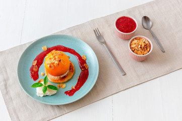 Roasted peaches with lemon, lime and basil creme fraiche and raspberry coulis. Tasty sweet fruit...