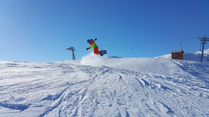 Naklejka na ściany i meble young skier skiing on the mountain and winter season, snow sale, ski resort 
