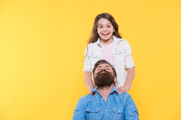 Family barbershop. Happy child and bearded man. Little daughter and father with beard. Haircut and shave. Barbershop care. Barber shop. Hair salon. Barbershop reopening, copy space