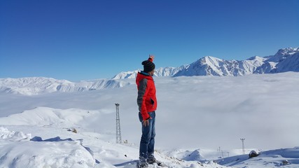 Fototapeta na wymiar young skier skiing on the mountain and winter season, snow sale, ski resort 