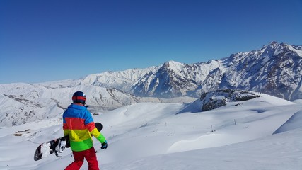 a young skier skiing on the mountain, winter season and snow landscape
