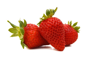 Three strawberry isolated on a white background, macro image