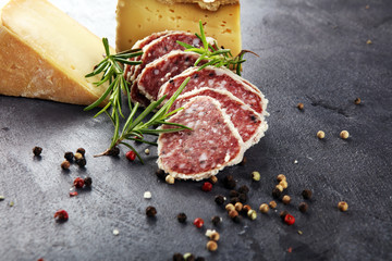 Salami truffle. The saltufo is a piece of salami mixed with summer truffle and parmesan on table