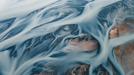 A glacial rivers from above. Aerial photograph of the river streams from Icelandic glaciers. Beautiful art of the Mother nature created in Iceland. Wallpaper background high quality photo - 373760386