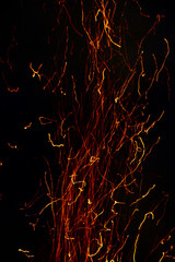 Sparks of fire rising in the dark