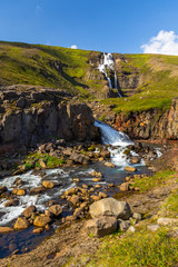 Fototapeta na wymiar Rjukandi waterfall, located on the Ring Road in eastern Iceland.