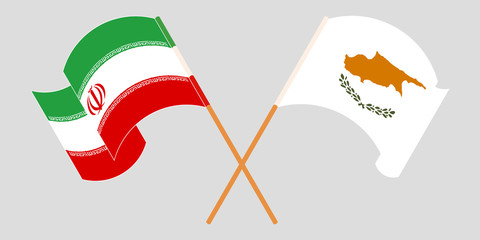 Crossed and waving flags of Iran and Cyprus