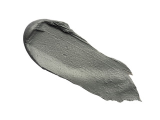 Creamy body scrub smeared on white background. Isolated