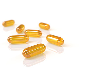 3D rendering of fish oil capsules on white background with selective focus technique