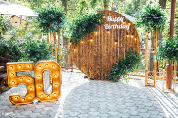 Round wooden arch, photo zone for a photo shoot for a 50th anniversary man