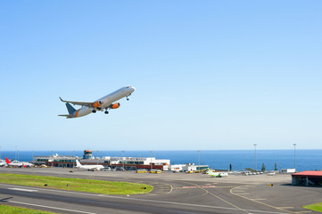 Airplane taking off airport Madeira - 373763995