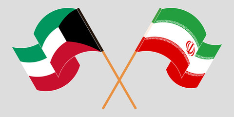 Crossed and waving flags of Iran and Kuwait