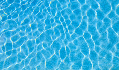 Abstract ripped water in swimming pool with blue radial texture ripples background