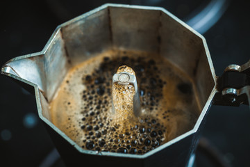 Macro shot of making cooffee in the moka pot. Hot fresh espresso