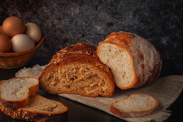 Fresh bread with bran, seeds and oatmeal on the table