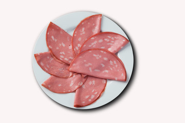 slices of mortadella served with lemon .. top view