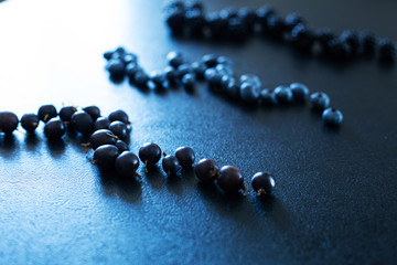Mix set layout of different types of black berries  on a black table. Stylish seasonal vitamins