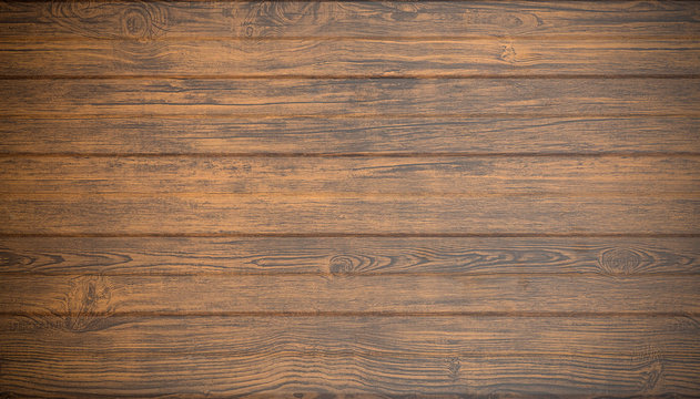 Old wooden background in rustic style. Dark wooden background with the structure and pattern of boards and panels. Copy space.