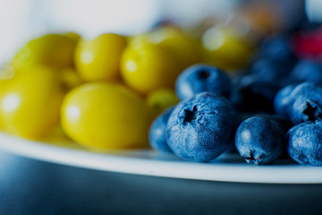 Mix of yellow and blue berries. Summer mick fruit. Berry layout