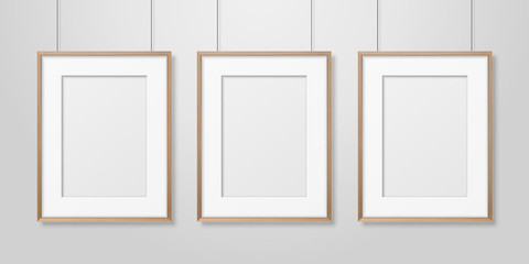 Vector 3d Realistic Three A4 Brown Wooden Simple Modern Frame on a White Wall Background. It can be used for presentations. Design Template for Mockup, Front View