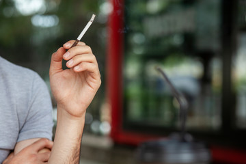 Cigarettes in men's hands
