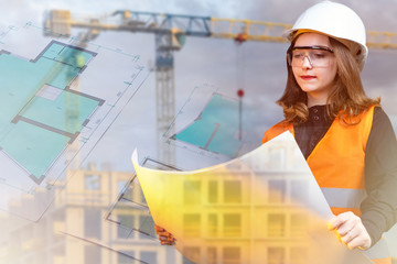 Architecture. The girl works as an architect. A woman creates construction projects. Girl on the background of construction documentation and tower crane. A woman is considering construction plans.
